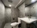 Modern bathroom with grey tile walls and flooring