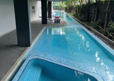 Outdoor swimming pool with seating area