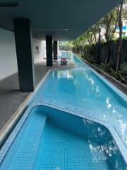 Outdoor swimming pool with seating area