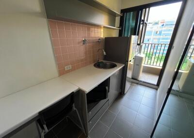 small kitchenette with balcony view