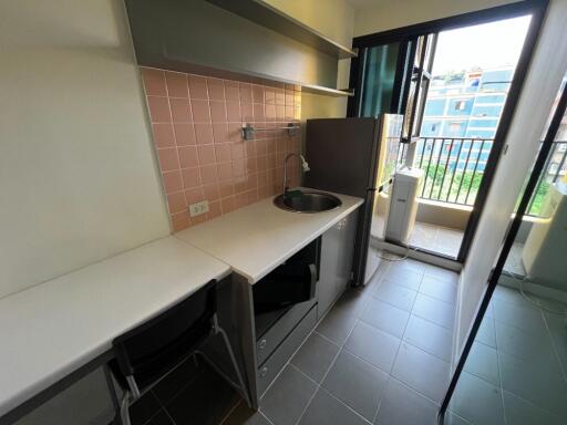 small kitchenette with balcony view