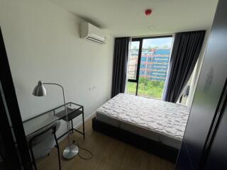 Bedroom with large window and a view