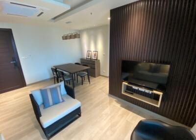 Modern living room with dining area and entertainment system