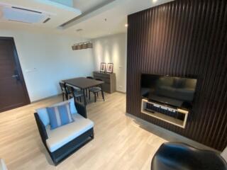 Modern living room with dining area and entertainment system