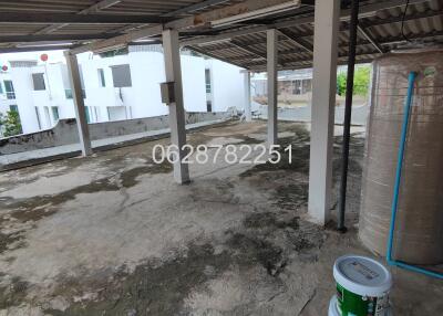 Rooftop area with view of neighboring buildings