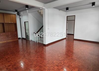 Spacious living area with wooden floors