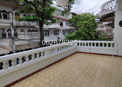 Balcony with terrace view and surrounding buildings