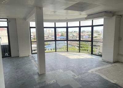 spacious living room with large windows and city views