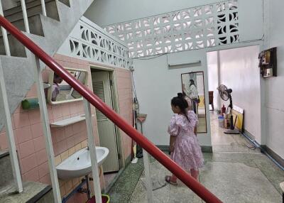 Entrance hallway with stairs and corridor