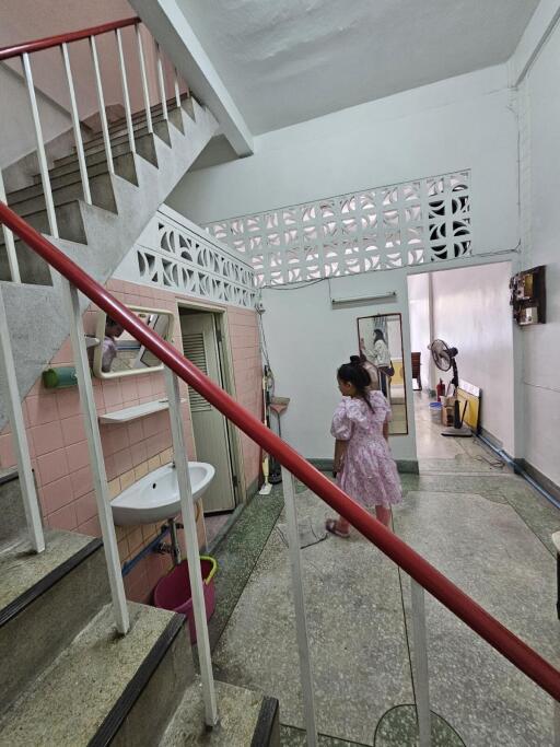 Entrance hallway with stairs and corridor