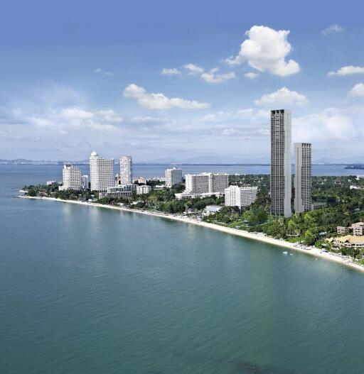 Aerial view of coastal city with skyscrapers and coastline