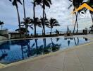 Swimming pool area with ocean view