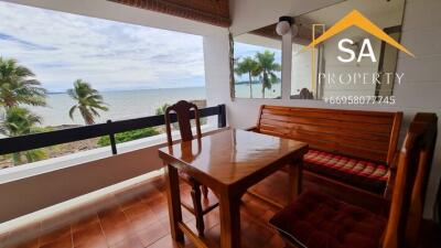 Balcony with ocean view and wooden furniture