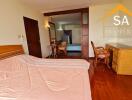 Bedroom with hardwood floors and wooden furniture