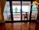 Living area with view of the balcony and ocean