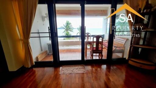 Living area with view of the balcony and ocean