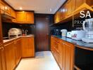 Modern kitchen with wooden cabinetry and appliances