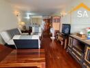 Living room with wooden flooring and modern furnishings