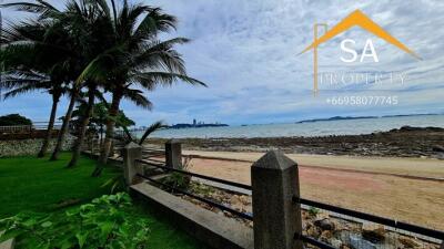 Beachfront with view of sea and skyline