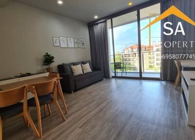 Modern living room with dining area and balcony access