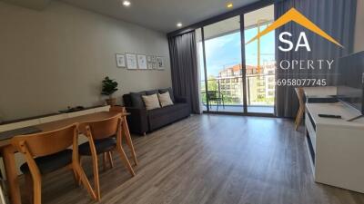 Modern living room with dining area and balcony access