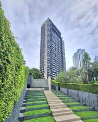 High-rise building with landscaped walkway