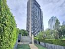 High-rise building with landscaped walkway