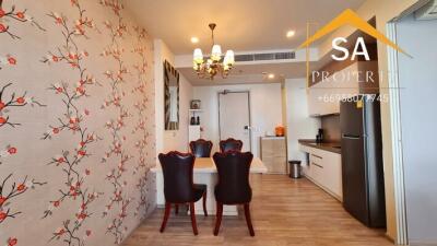 Dining area with a table and chairs near a kitchen