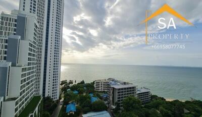 View of tall buildings and ocean from a high-rise apartment