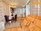 Spacious living room and dining area with brown couch and dining table