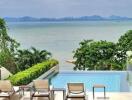 Oceanview outdoor space with pool and lounge chairs