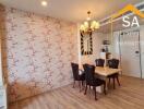 Dining room with floral wallpaper and chandelier