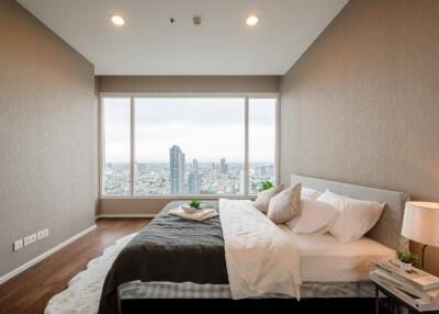 Modern bedroom with large window and city view