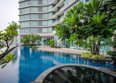 Modern building with outdoor pool and greenery