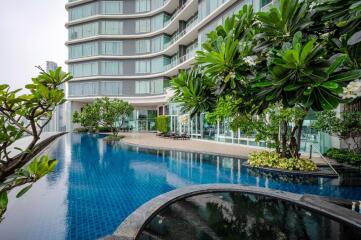 Modern building with outdoor pool and greenery