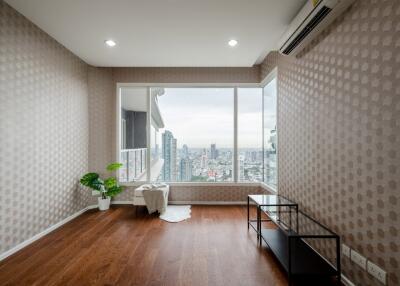 Modern living room with large window and city view