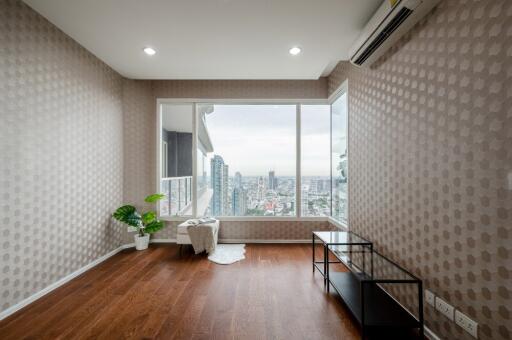 Modern living room with large window and city view