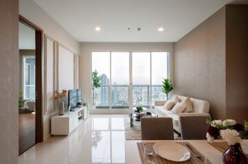 Modern living room with large windows and city view