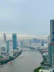 Scenic view of a river flowing through the city with high-rise buildings