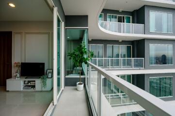 Modern living room with large balcony and outdoor view