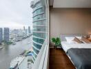 Bedroom with a view of the city and river