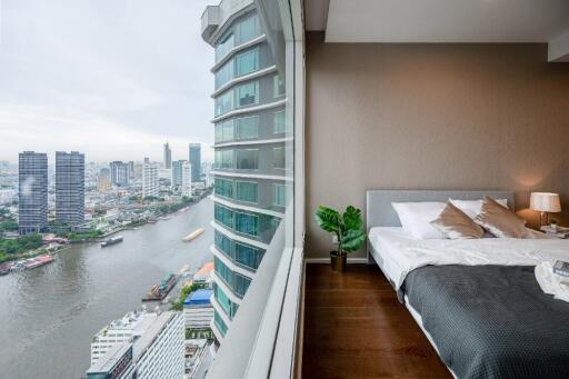 Bedroom with a view of the city and river