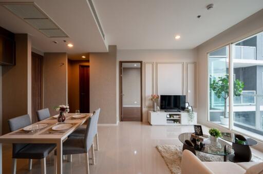 Modern living room and dining area with natural light