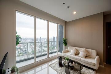 Modern living room with large windows and city view