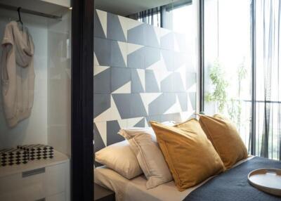 Modern bedroom with geometric accent wall