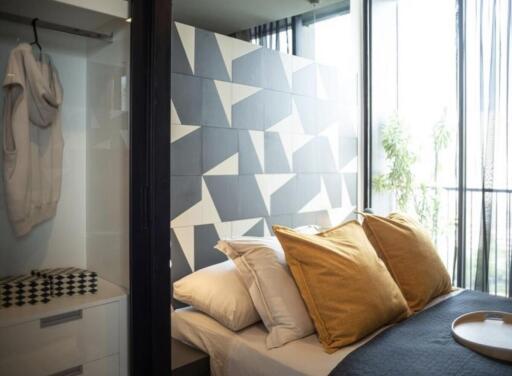 Modern bedroom with geometric accent wall