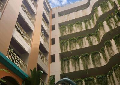 Courtyard with greenery and multi-story building