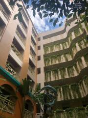 Courtyard with greenery and multi-story building