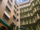 Courtyard with greenery and multi-story building