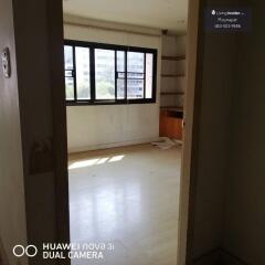 Spacious empty bedroom with large windows